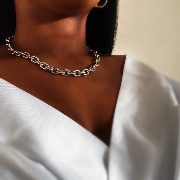 silver chunky chain on brown skin